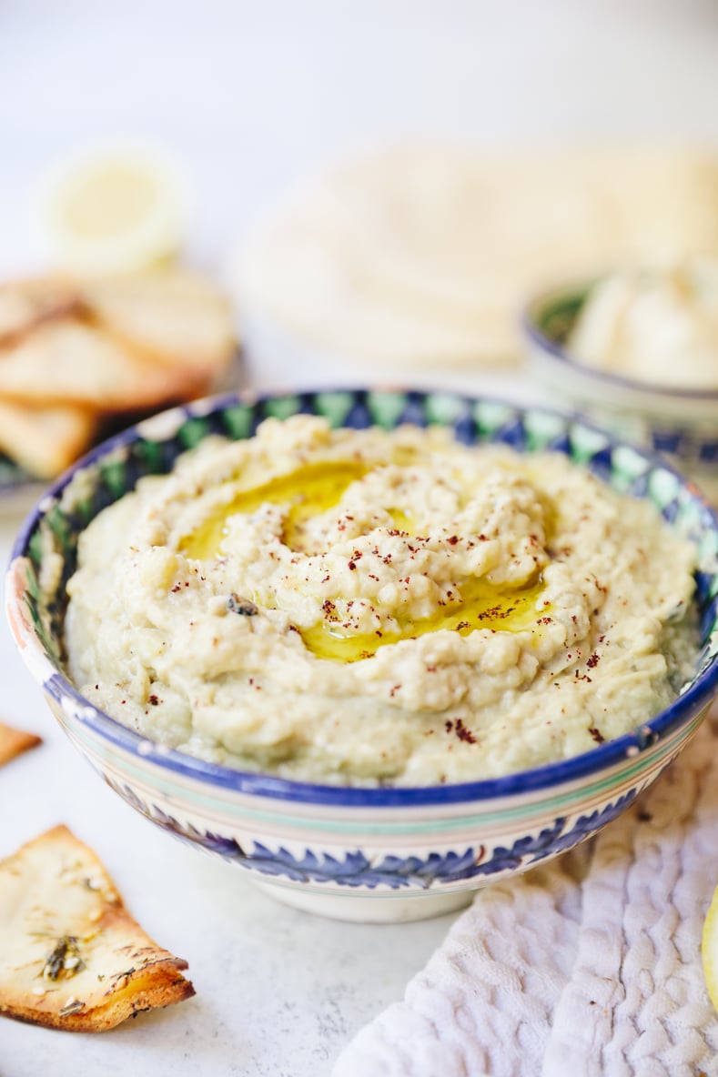 baba ghanoush recipe in a middle eastern inspired bowl with pita chips