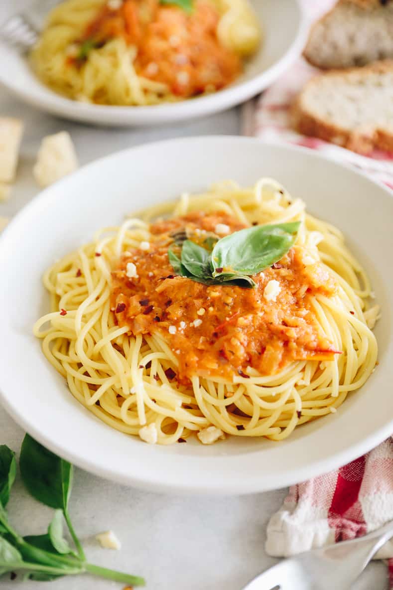 A picture of homemade arrabbiata sauce over spaghetti.