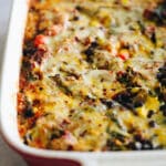 Close up shot of a quinoa taco casserole in a baking dish.