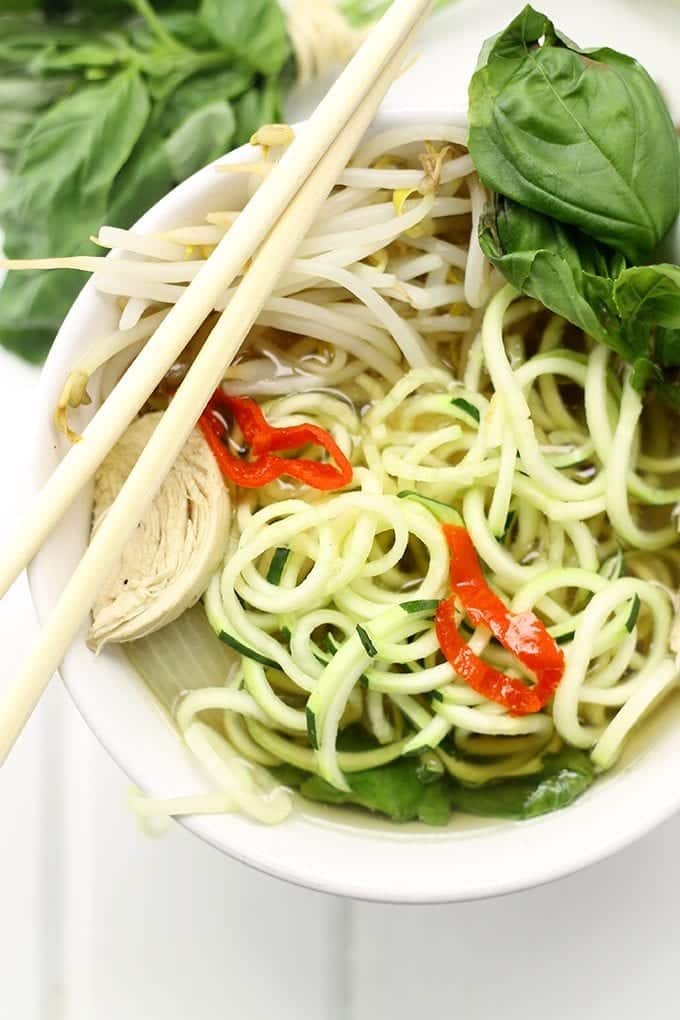 Homemade Vietnamese Pho soup that's been healthified with zucchini noodles and packed-full of veggies. Don't be intimidated, this Healthy Chicken Pho with Zucchini Noodles is a lot easier than you think!