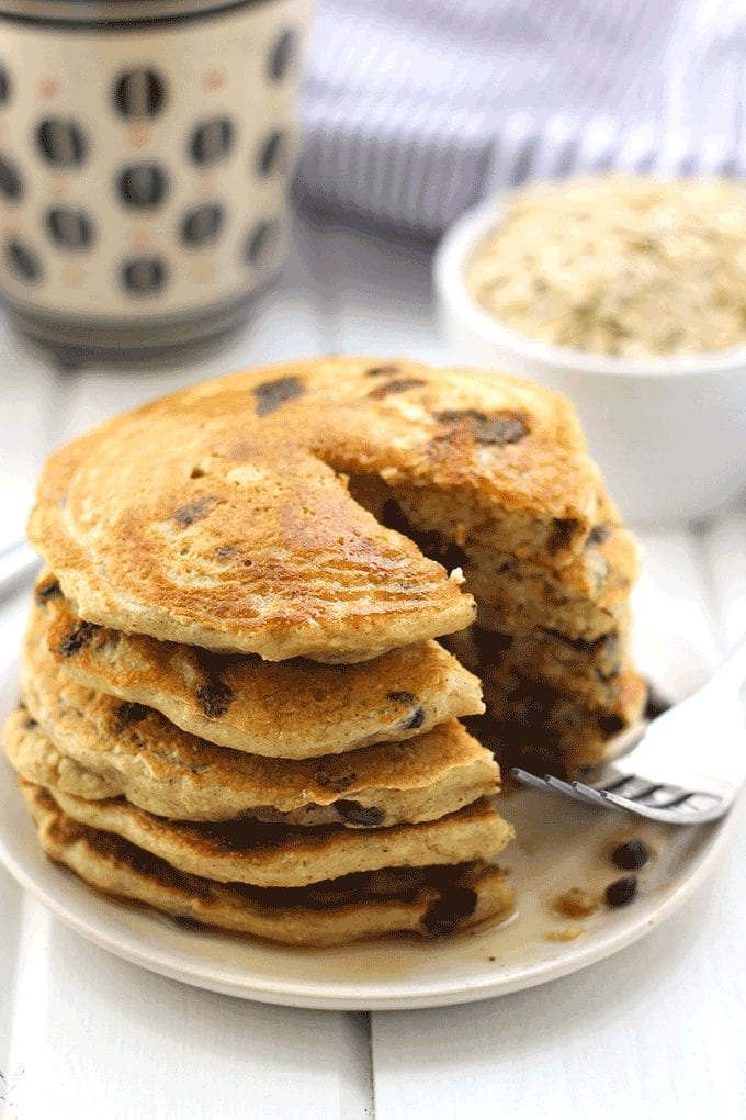 Oatmeal meets pancakes with The Fluffiest Oatmeal Chocolate Chip Pancakes. These pancakes are gluten-free, refined sugar-free and high in protein but are the most delicious, fluffiest pancakes you will ever eat. They will quickly become a weekend brunch recipe staple!