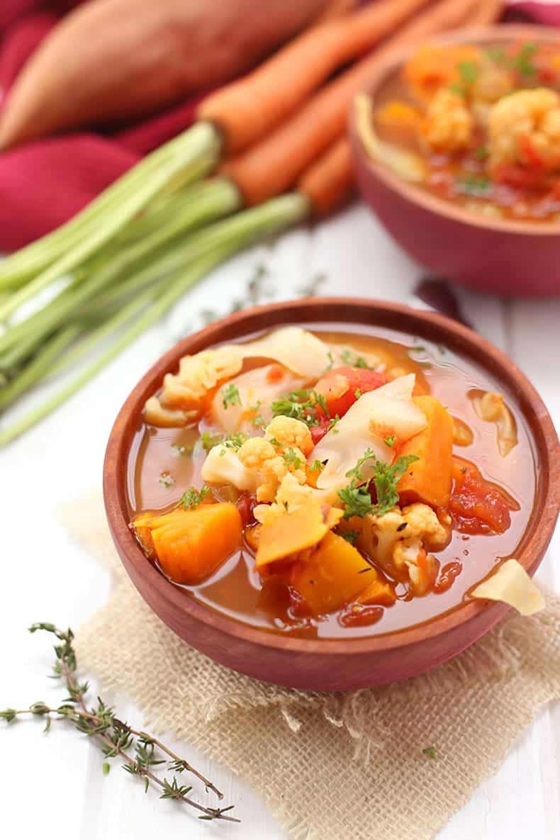 a picture of fall detox vegetable soup with 9 different vegetable varieties
