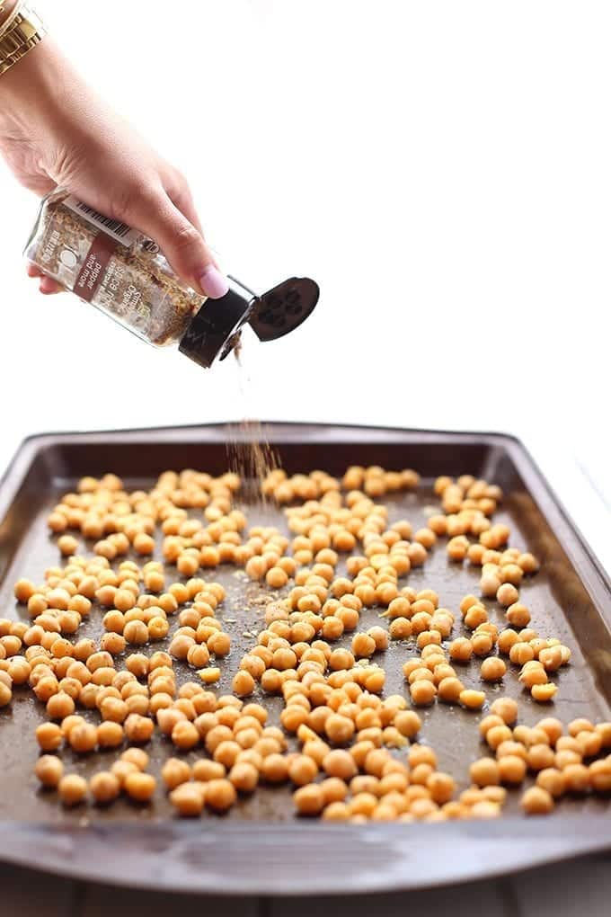 Swap out those bags of chips for these crunchy and zesty Lemon Pepper Roasted Chickpeas. They make the perfect snack option or salad or soup topper for a bit of extra crunch! Just 5 ingredients and you're ready to go.