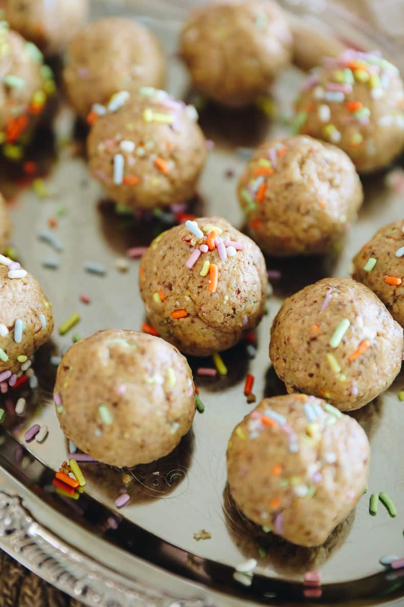 a recipe for birthday cake protein balls on a plate