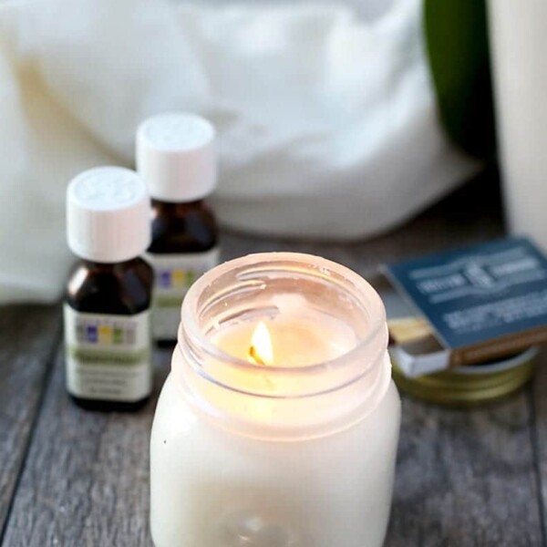 A tutorial teaching you how to make homemade aromatherapy candles. These diy scented candles are made with just two simple ingredients: soy wax and essential oils. Anyone can make these candles at home! #diy