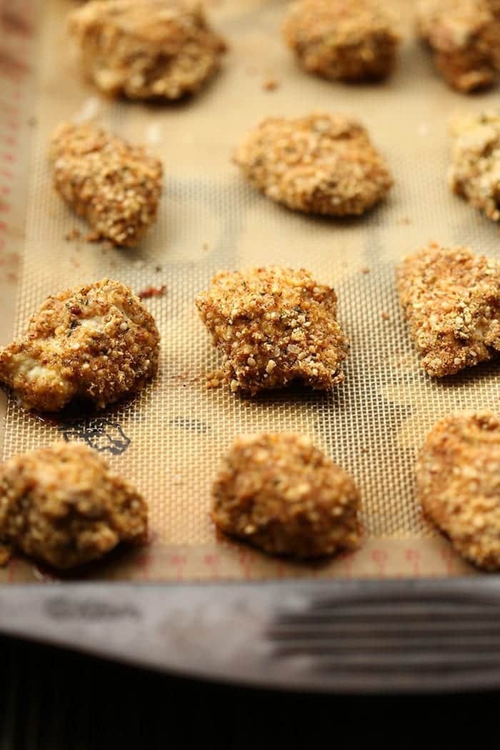 Eat your favorite childhood food without having to deep fry a thing with these Healthy Chicken Nuggets! They're baked instead of fried and coated with a Hemp Heart crust to make a zesty and flavorful childhood recipe classic, revamped!