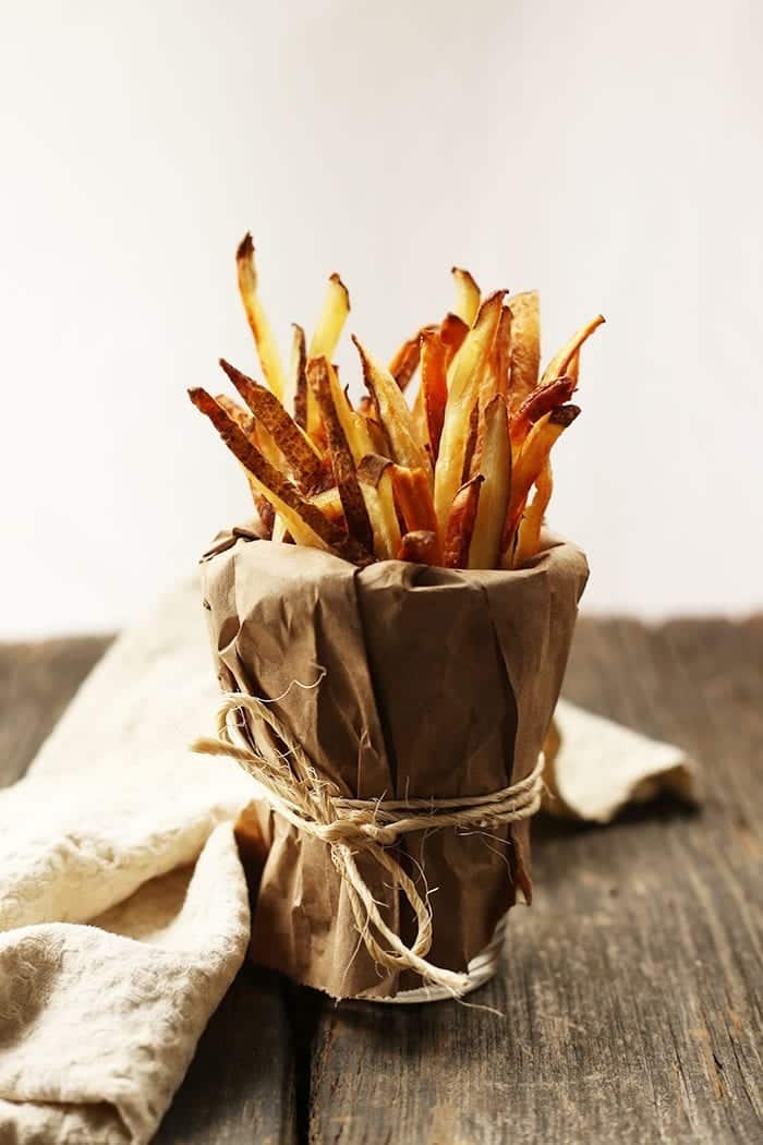 Have you ever wondered how to make crispy baked french fries without them burning? Here's my trick to the ultimate french fries recipe without going near a deep fryer!