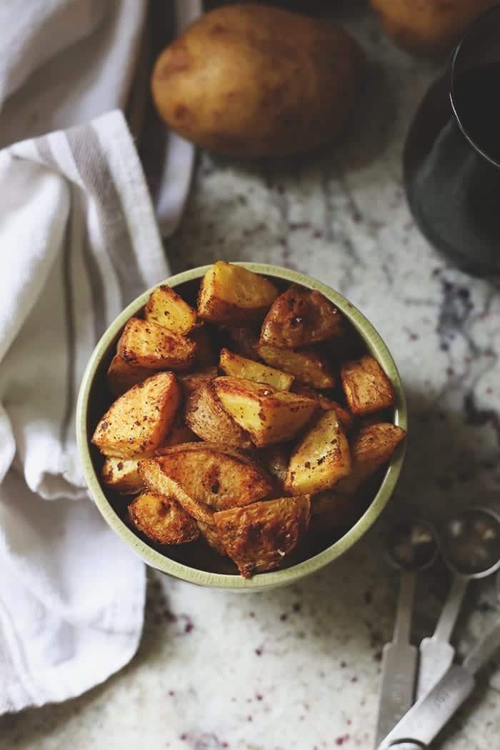 Revisiting an old THM classic with a tutorial on how to make the perfect roasted potatoes. With two variations for when you're in a rush or have more time! They're crispy on the outside and soft on the inside with a delicious spicy coating.