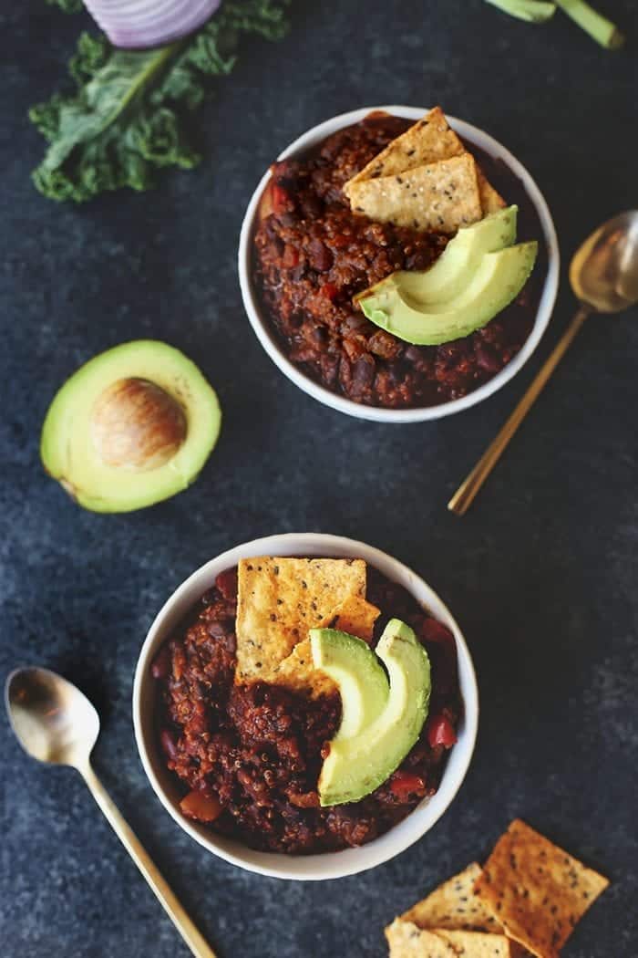 overhead image of vegetarian chili with avocado and tortilla chips