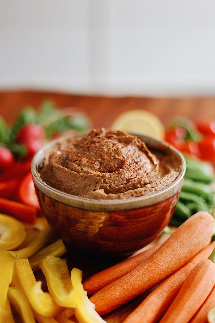 Mexican meets the Mediterranean with this Spicy Chipotle Black Bean Hummus. The perfect appetizer recipe for your next dinner party or pair with veggies or crackers for a weekday snack!