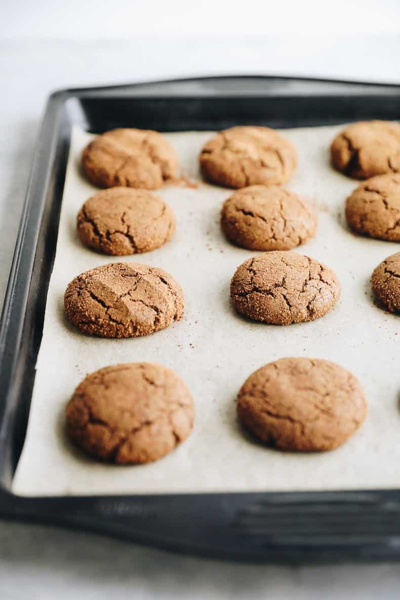 Baked ginger molasses cookie recipe on a baking sheet