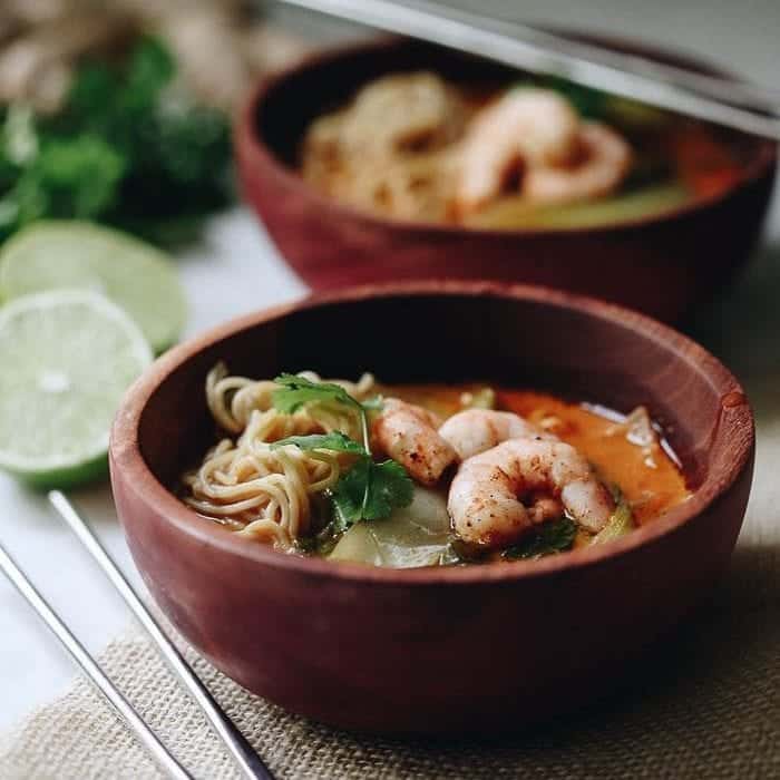 This Curried Thai Coconut Ramen with Shrimp is zesty and spicy with a protein boost from the shrimp and whole-grain, gluten-free noodles. A bone-warming soup recipe that comes together in 40 minutes.