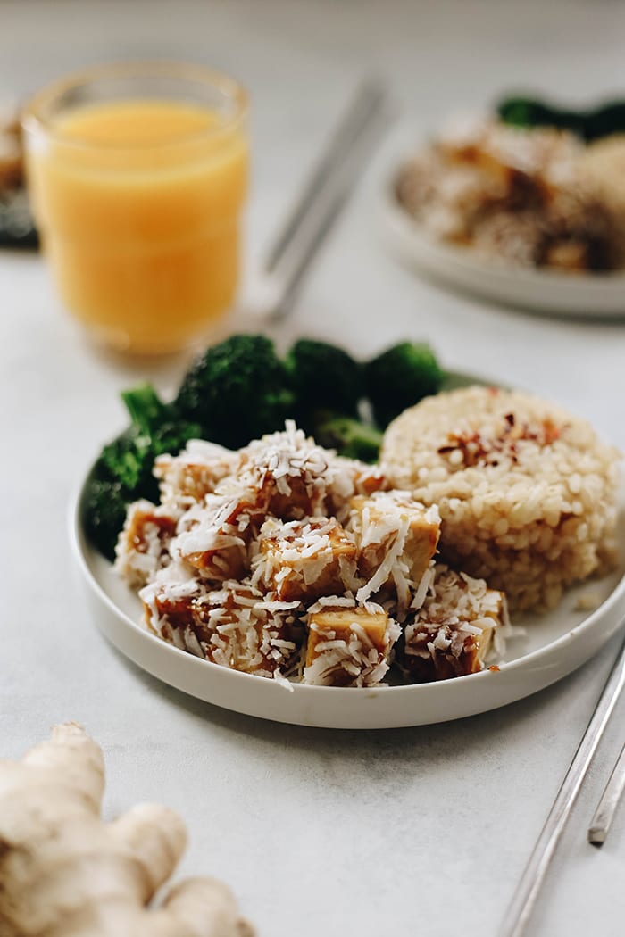 The sweet and tangy flavor of orange pairs perfectly with coconut in this orange coconut baked tofu recipe. Pair with rice and veggies for a vegetarian meal full of flavor and nutrition!