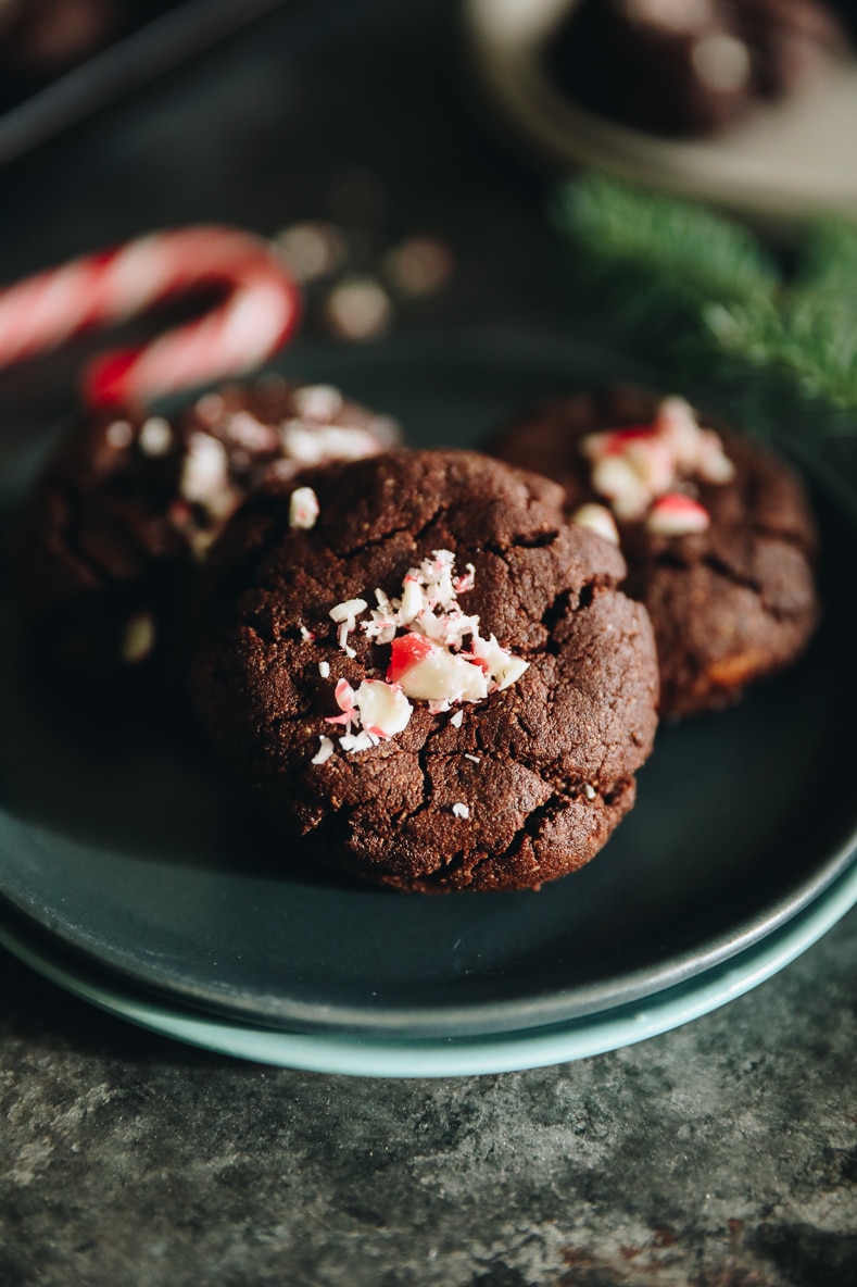 close up image of chocolate peppermint cookies with crushed candy cane in the center