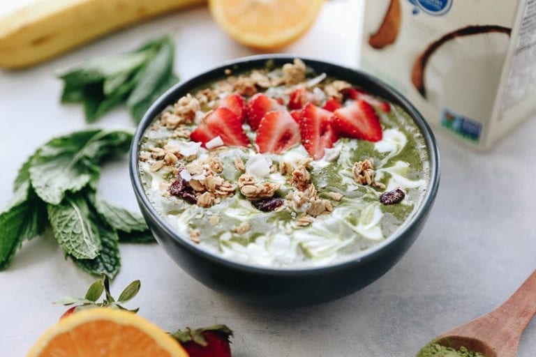 A healthy breakfast recipe made with matcha, fresh mint, banana and coconut milk. This Matcha Mint smoothie bowl is a fun twist on the tropics!