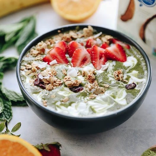 A healthy breakfast recipe made with matcha, fresh mint, banana and coconut milk. This Matcha Mint smoothie bowl is a fun twist on the tropics!