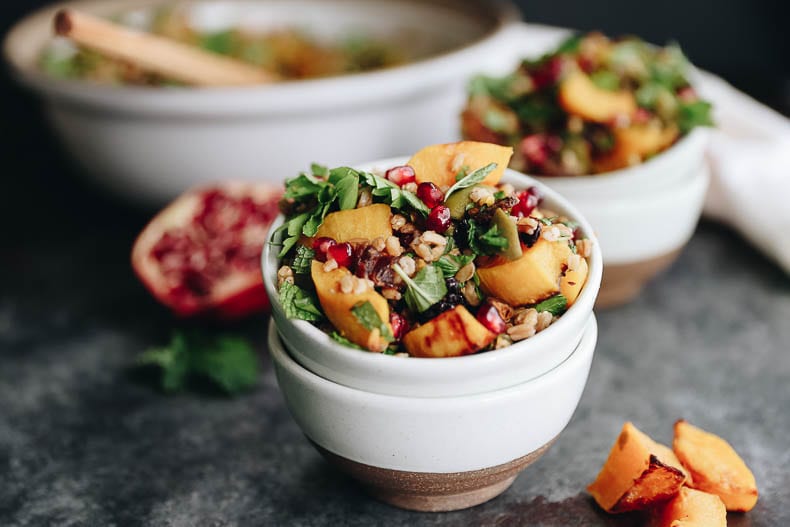 Get the best of fall with this Harvest Farro Salad with Roasted Butternut Squash and a Pomegranate Molasses Dressing. A seasonal favorite full of nutrition and delicious flavors for a side dish or main! #salad #farro #grainsalad