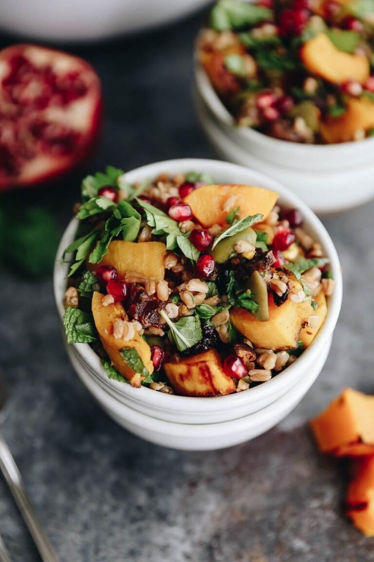 Get the best of fall with this Harvest Farro Salad with Roasted Butternut Squash and a Pomegranate Molasses Dressing. A seasonal favorite full of nutrition and delicious flavors for a side dish or main! #salad #farro #grainsalad