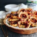 This Maple Roasted Squash with Tahini Yogurt Dressing makes a perfect weeknight dinner or Thanksgiving side dish. The squash caramelizes and is topped my a thick and creamy tahini yogurt dressing topped with pepitas and pomegranate seeds. You'll be going back for seconds! #thanksgiving #thanksgivingsides #glutenfree
