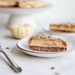 This creamy vegan pumpkin caramel tart gives pumpkin pie a serious run for its money. Made with a simple granola crust and a smooth cashew based pumpkin-filling this dessert recipe will quickly become a winter favorite!