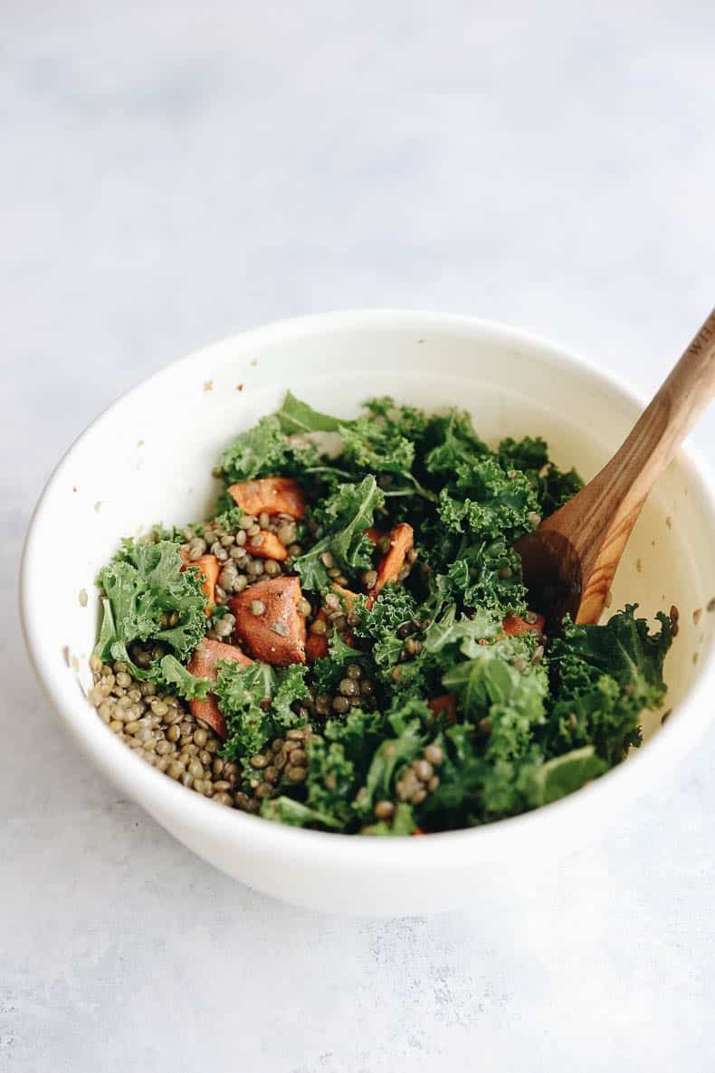 Preparing this Warm Lentil and Sweet Potato Salad with Kale and Goat Cheese