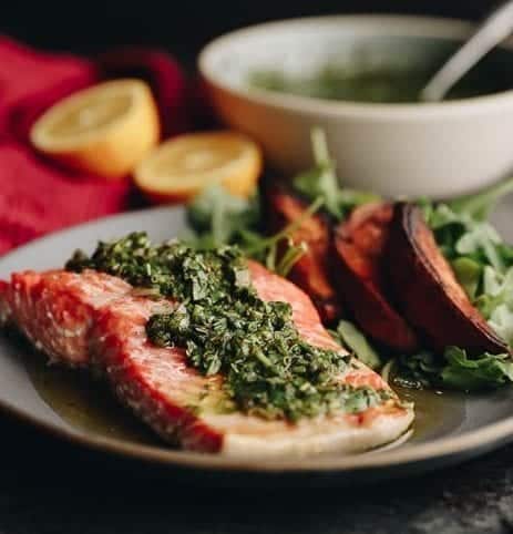 Delicious and healthy baked chimichurri salmon which is ready in under 20 minutes. Perfect for a delicious weeknight dinner #chimichurri #salmon