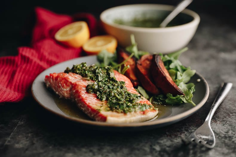 Delicious and healthy baked chimichurri salmon which is ready in under 20 minutes. Perfect for a delicious weeknight dinner #chimichurri #salmon
