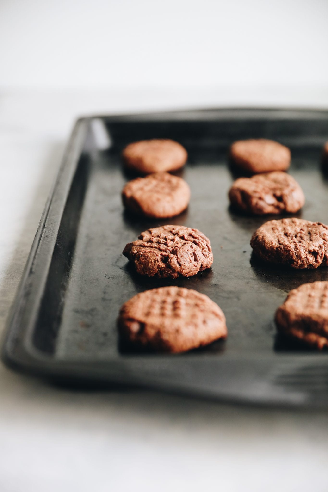 Double chocolate cookies on a baking sheet.