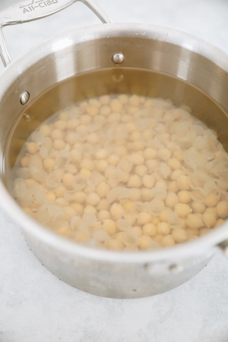 skins removed from chickpeas in a pot