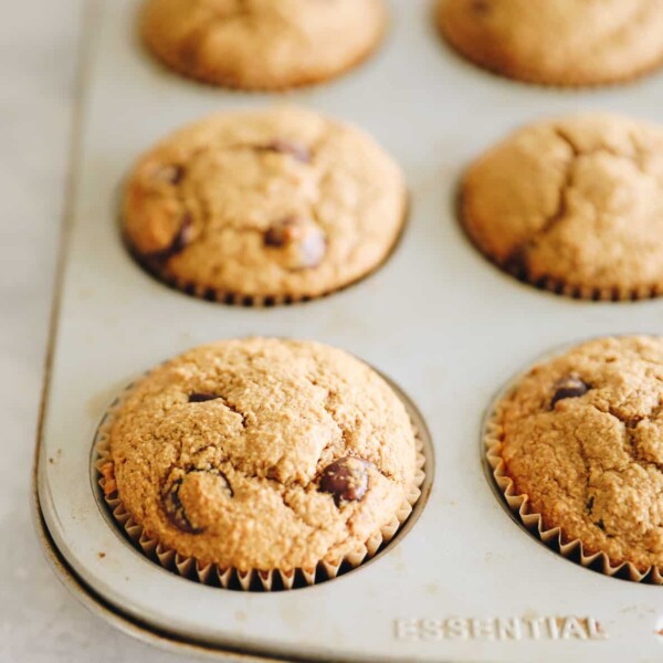 Oat flour muffins in a muffin tin.