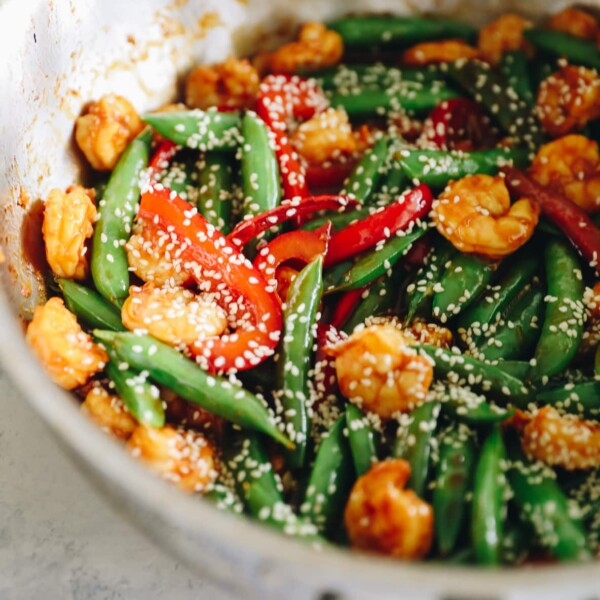 Sauté pan with spicy sesame shrimp and veggie stir fry.