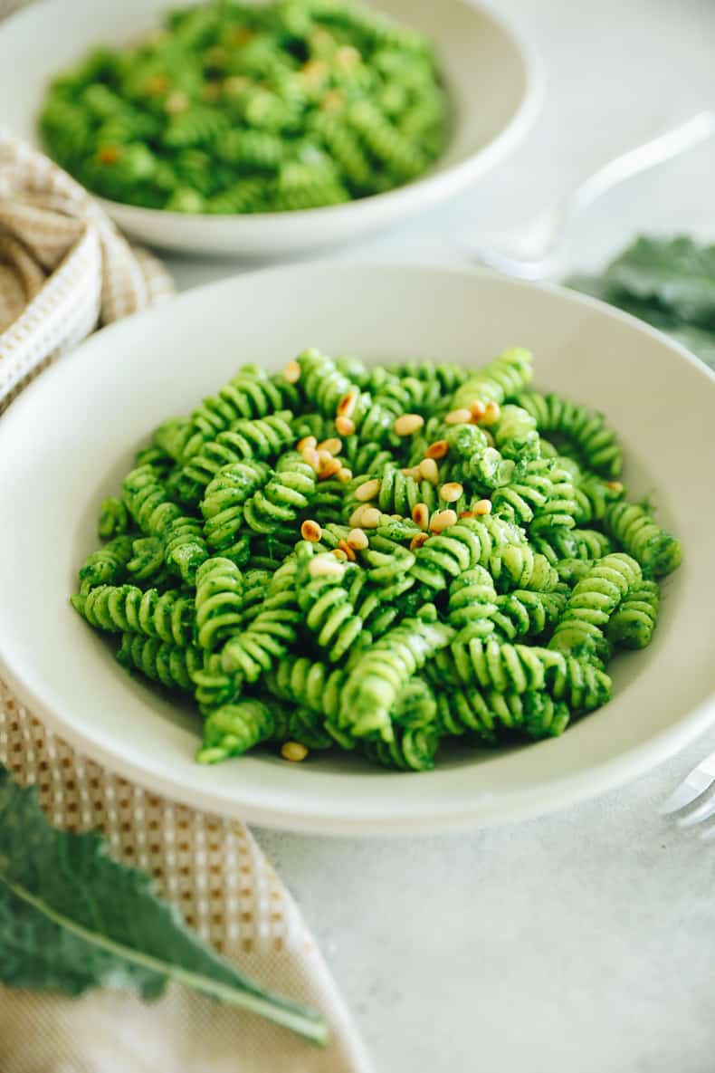 a bowl of kale pesto on pasta