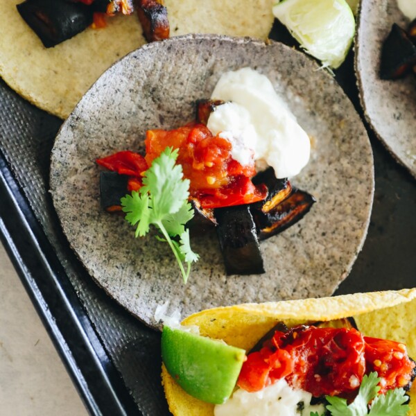 eggplant tacos laid flat on a baking tray