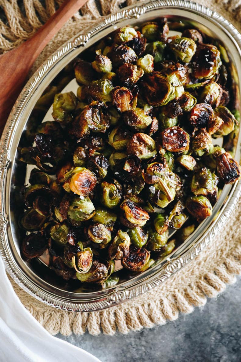 roasted brussel sprouts in silver dish.