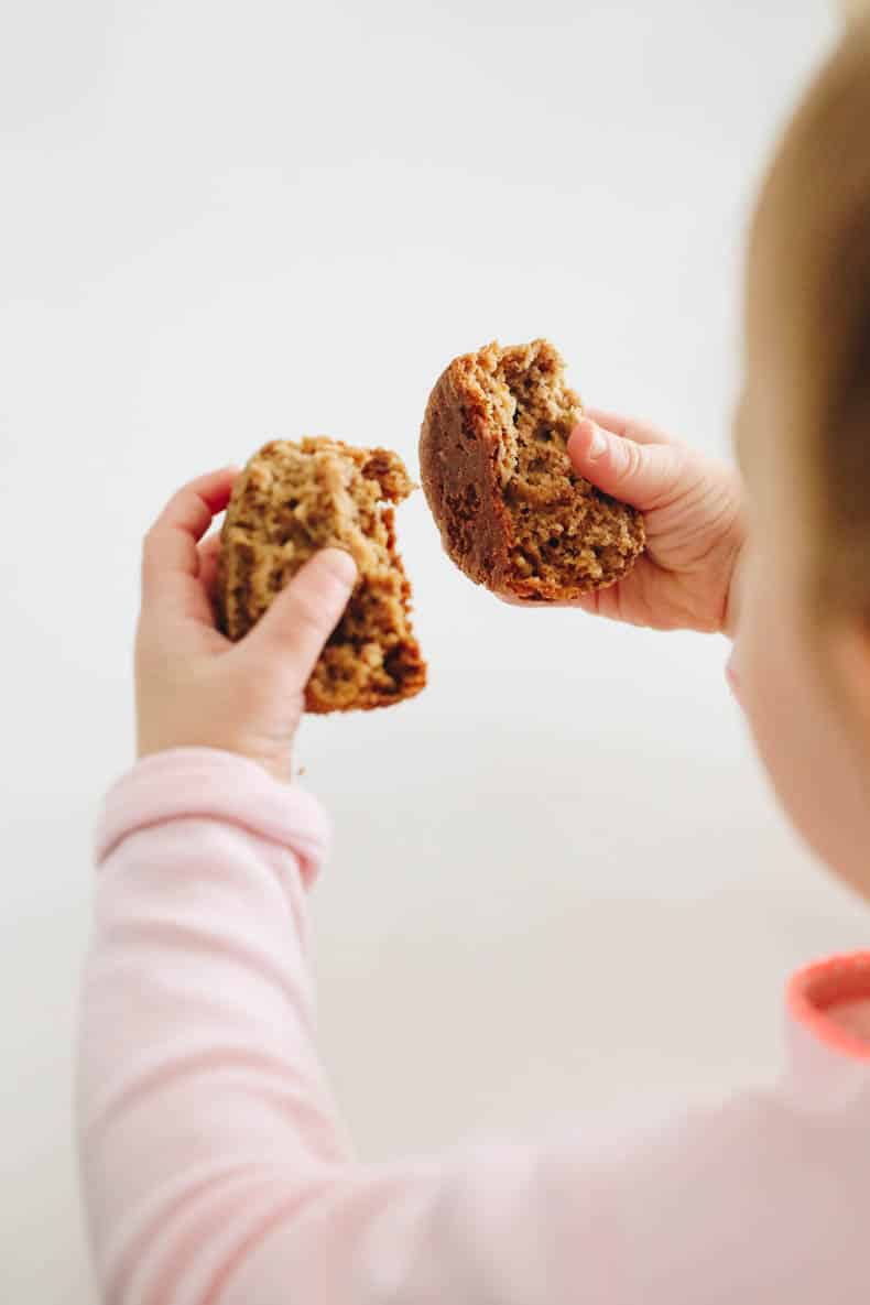 baby holding baby banana muffins