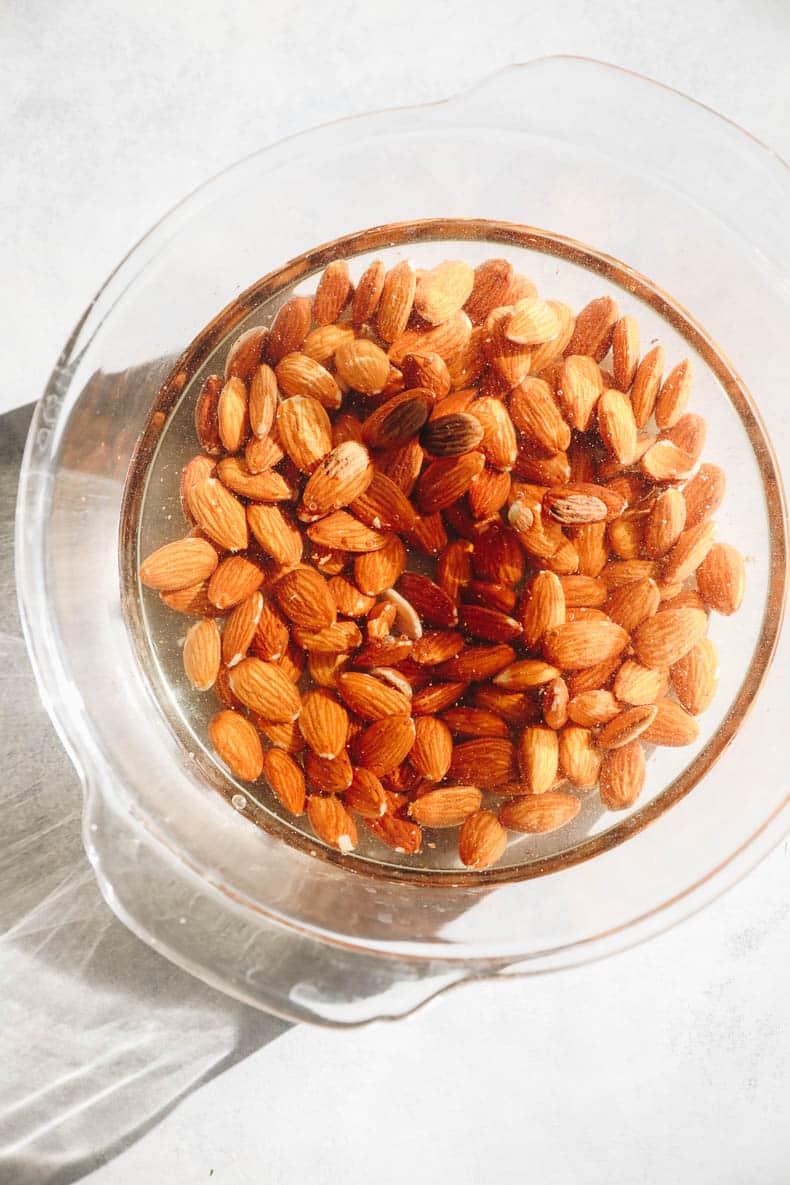 soaking almonds in a glass bowl