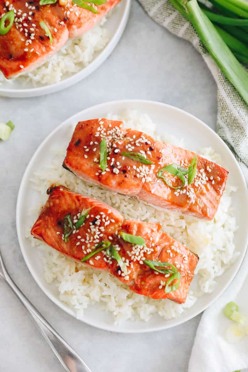 Upper photo of miso salmon on a bed of rice.