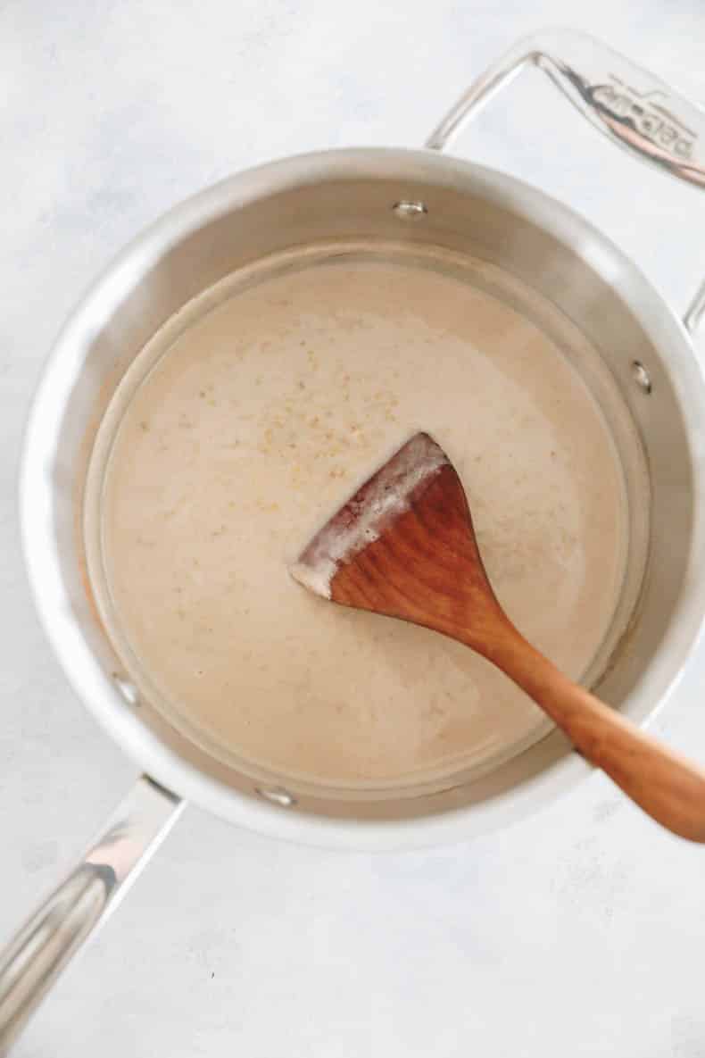 steel cut oats cooking in a saucepan