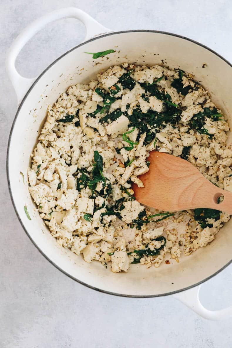 crumbled tofu in a dutch oven cooked for tofu pasta bolognese