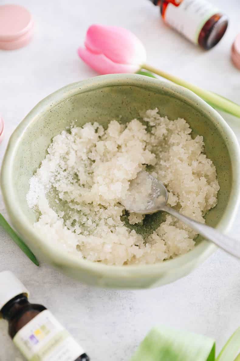 diy lip scrub combined together in a green bowl.