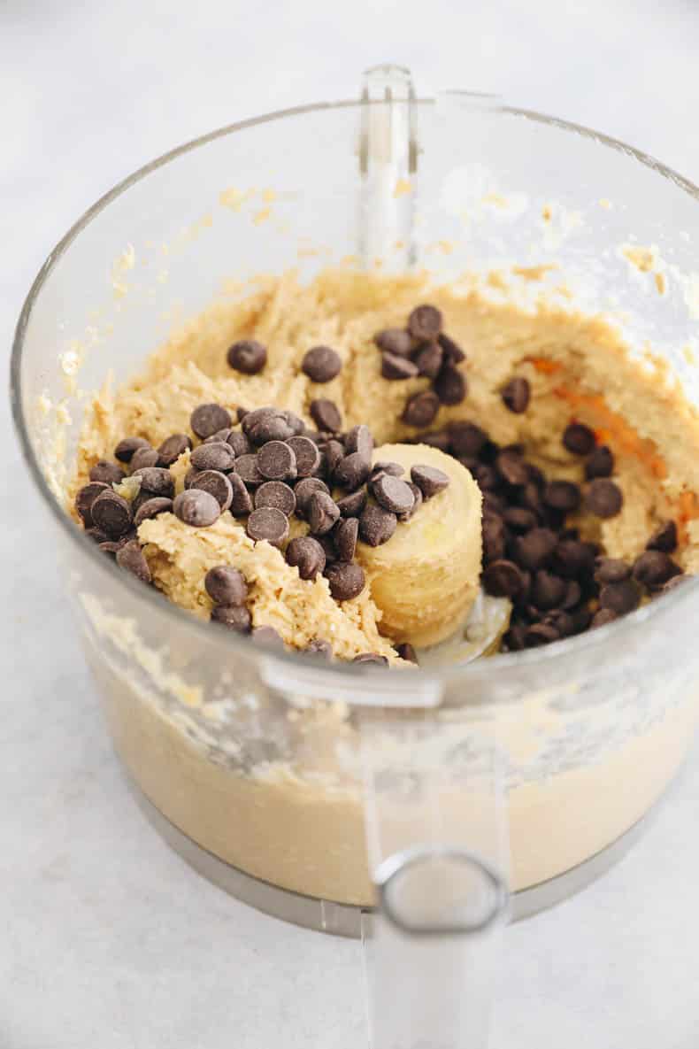 chocolate chips in a food processor added to chickpea blondie batter.