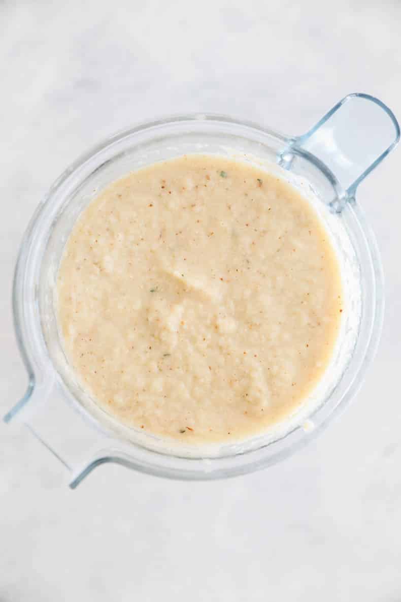 roasted cauliflower soup pureed in a blender.