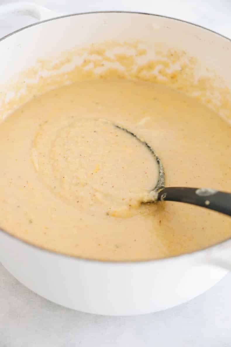 pot of roasted cauliflower soup with a ladle.