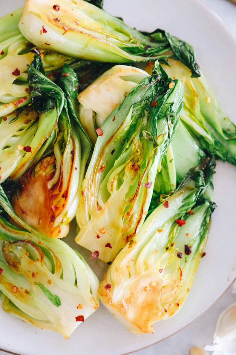 Garlic baby bok choy recipe on a plate.