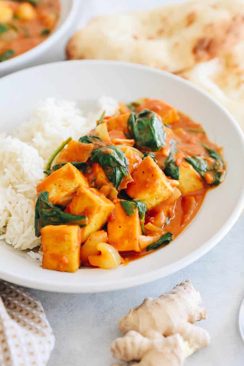 tofu curry in a shallow bowl with rice.