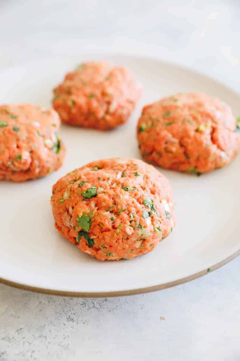 salmon burger recipe on a plate.