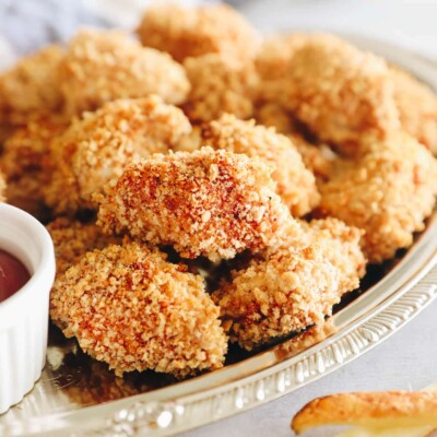 homemade chicken nuggets recipe on a silver platter.
