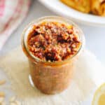 sun dried tomato pesto in a glass jar.