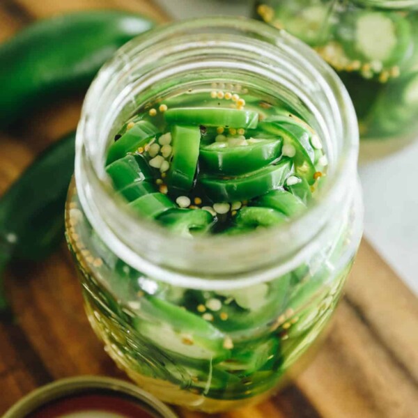Pickled Jalapeño Recipe in a clear mason jar.