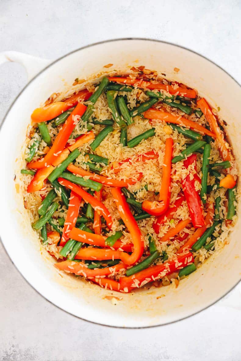 veggies and rice in a dutch oven.